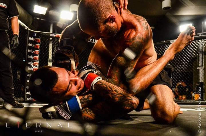 Bretto grappling in the cage